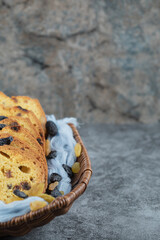 Pie slices with black sultana in a wooden basket