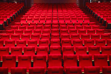 Red chairs in an empty concert hall