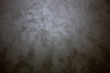 Designed stone structure with orange spots stucco background (plastered wall texture).	