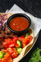 Kebap, roasted meat and vegetables on grill