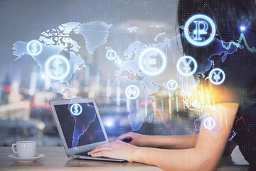 Double exposure of businesswoman hands typing on computer and forex chart hologram drawing. Financial analysis concept.