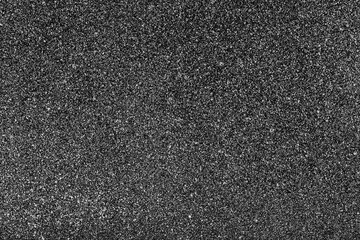 Black and white grain. Noise background. Splatter texture. Distressed grunge pattern. Black overlay background. Spray paint effect. Grainy paper background.