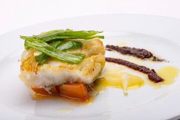 Fresh hake with sauteed vegetables