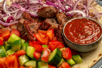 Kebap, roasted meat and vegetables on grill