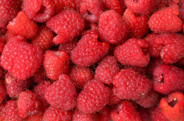 strawberries raspberries  a wooden table
