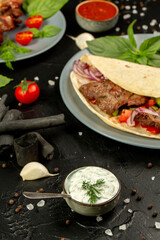 Kebap wrapped in a very thin pita or lavash 