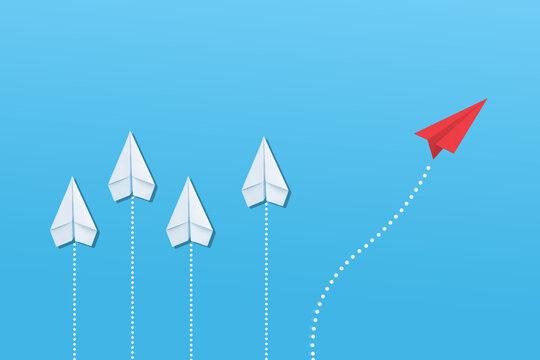 Group of paper plane in one direction and with one individual pointing in the different way. Business concept for new ideas creativity and innovative solution.