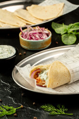Kebap wrapped in a very thin pita or lavash 