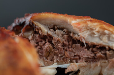 Grilled chicken leg on white plate