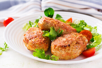 Meatballs with cabbage. Lazy cabbage rolls with fresh salad on light background. Russian cuisine.