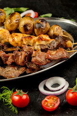 Kebap, roasted meat and vegetables on grill
