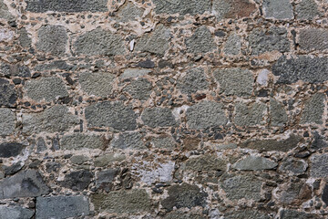 background, texture - ancient masonry at the wall of the castle