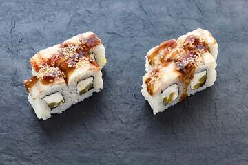 rolls with teriyaki sauce. Rolls and sushi. Avocado, rice, eel. Eel rolls. serving a dish