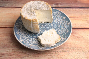 Soft organic goat cheese with white mold