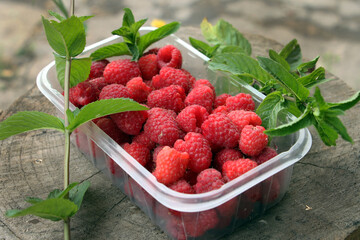 raspberries on wooden background