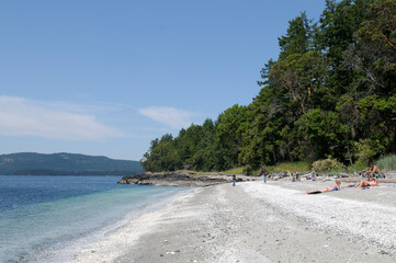 People on the beach near Kanaka Bluff, Portland Island, British Columbia, Canada