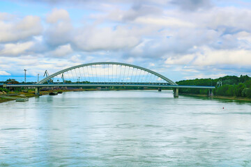 Modern arched Apollo bridge and Danube river in Bratislava, Slovakia