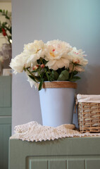 White peonies with blue flowerpots in the interior