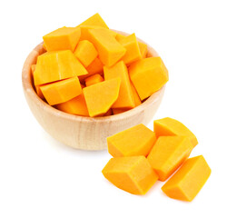 A group of cut and slice butternut squash chunks in wooden bowl and haft squash on a white background.