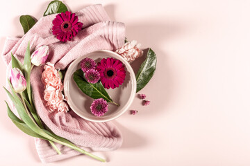 Spa background with flowers and towel, copy space