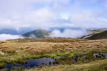 landscape in the mountains with clouds