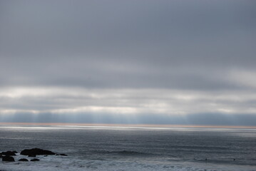 Naklejka na ściany i meble ocean beach with waves, in the sunrise & clouds 