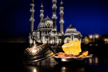Ramadan concept with dried dates on silver bowl