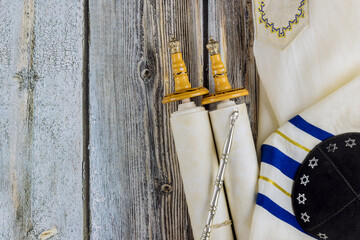Jewish holidays, during prayer items kippa with prayer shawl tallit on shofar, torah scroll