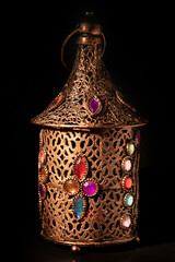 Old bronze arabic lamp isolated on black