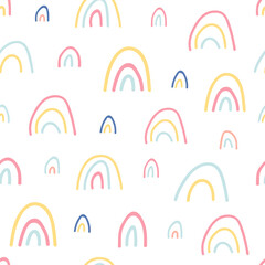Unique hand drawn rainbow texture. Rainbow seamless pattern. Cute kids nursery background in pastel colors. Baby shower decoration. Lovely cartoon rainbows for wallpaper. Vector illustration