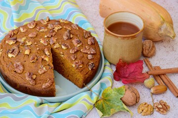 Pumpkin walnut cinnamon chocolate cake served with hot chocolate drink