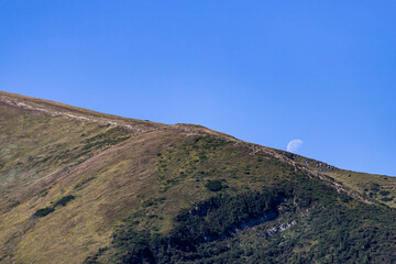 Fototapeta na wymiar landscape with blue sky and moon