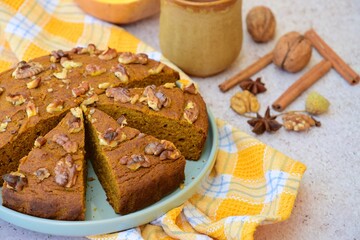 Pumpkin walnut cinnamon chocolate cake served with hot chocolate drink