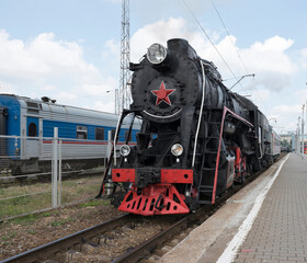 The locomotive of the last century standing under steam