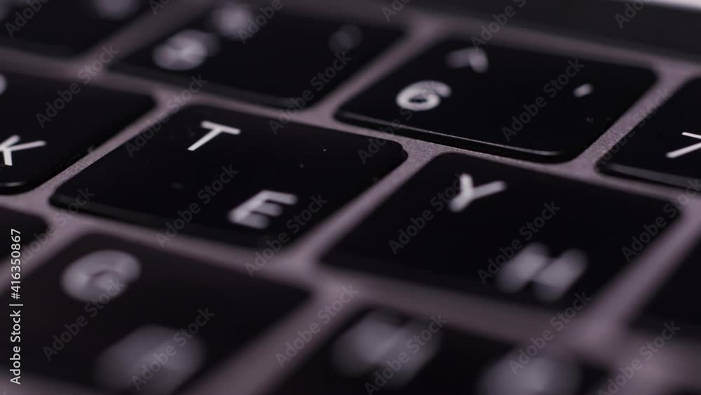 Poster close up of computer keyboard buttons. action. laptop keyboard with russian and english layout, conc