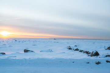 Sunset at frozen sea
