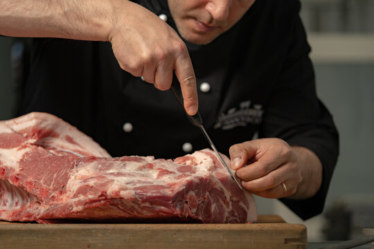 butcher processes the meat in the butchery