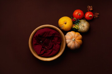 the wooden bed is decorated with autumn leaves and pumpkins. photo zone for a photo session of newborns. the bed is made of solid wood. backdrop for photography newborn