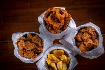 Fried snacks menu: potato, chicken, tapioca cubes and onion rings.