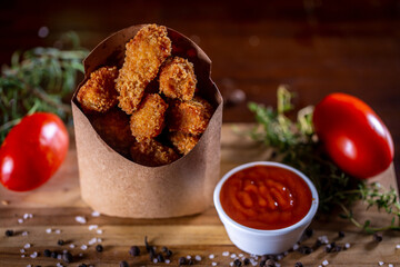 Fried chicken snacks in a wooden background