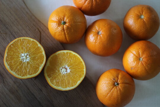 Kinnows and Sliced Kinnows which looks like Orange