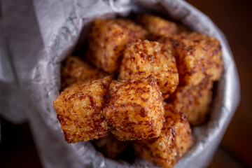 Tapioca cubes snacks in a wooden background