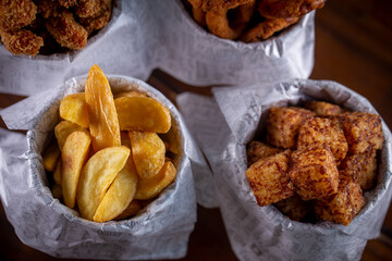 Fried snacks menu: potato, chicken, tapioca cubes and onion rings.