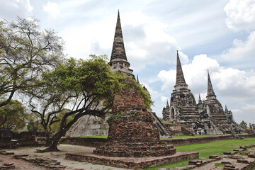Fototapeta premium AYUTTHAYA, THAILAND - MAY 25, 2018: Ayutthaya Historical Park in Ayutthaya (second capital of the Siamese Kingdom). A very popular destination for day trips from Bangkok. Wat Phrasisanpetch Temple. 