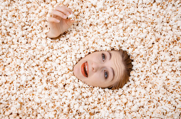 Girl portrait in popcorn. Image of beautiful european woman 20s eating popcorn. Eating popcorn....