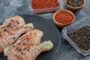 marinated raw chicken with different spices ready to cook