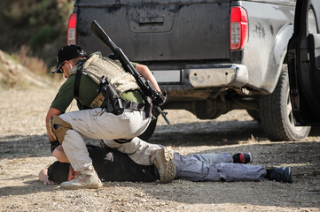 Army Soldiers detachment during complex anti-terrorist exercises. Shooting and weapons. Outdoor...
