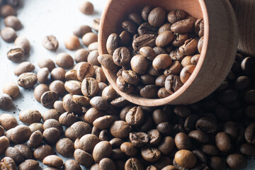 Coffee beans in a wooden cup