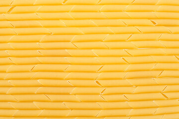 Pasta penne background close-up. View from above