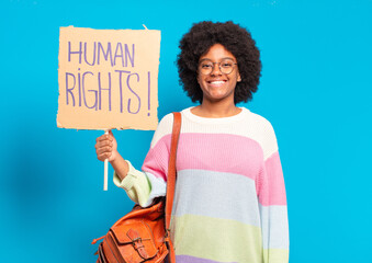 young pretty afro woman protesting with human rights banner